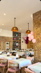 A montage showcasing the interior, exterior, and food offerings of Bazlama Kahvalti, a Turkish brunch spot in London. The video highlights the aesthetic decor, the preparation of gözleme, and a variety of breakfast dishes and drinks.