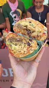 A creator at a music festival creates a 'pizza-wrapped burrito' by combining a burrito from Papi Chulo and a pizza from Freewheelin Pizza, showcasing the food preparation and the final indulgent result.