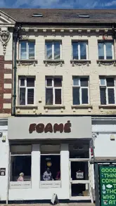 A short montage showcasing a cafe called Foamé, featuring close-ups of sandwiches, coffee, matcha, and the interior space.