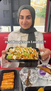 A food review video featuring a creator trying various burgers, loaded fries, and sides at The Burger Firm. The video highlights the menu items, including the 'pandemic burger' and 'mac burger', while emphasizing the portion sizes and sharing options.