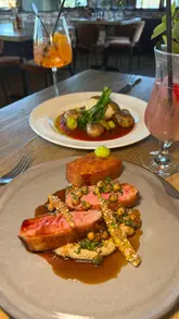 A montage showcasing the interior and various dishes at Omar's Table, a restaurant in Tamworth.