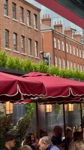 A montage showcasing the atmosphere, terrace, cocktails, and live music at Mollie's Studio IV in Manchester.