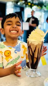 A video tour of a large buffet restaurant in Scotland, showcasing various food stations including Indian, Chinese, Italian, and a dessert section with a chocolate fountain.