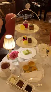 A high-quality, aesthetic montage showcasing a Wimbledon-themed afternoon tea at Hotel Café Royal, featuring close-ups of the themed pastries, finger sandwiches, and the elegant dining room setting.
