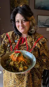 A review of Caffi Caban in North Wales, highlighting its community-focused ethos, use of homegrown produce, and variety of vegan and vegetarian dishes.