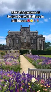 A short, static video showcasing the gardens at Seaton Delaval Hall in full bloom, featuring the historic hall in the background.