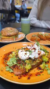 A brunch review of Davey's in Newcastle, showcasing various dishes including avocado toast, grilled cheese, and matcha lattes.