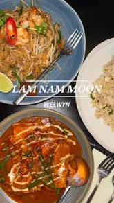 A montage-style video showcasing the exterior, menu, drinks, and various Thai dishes at Lam Nam Moon restaurant. The video features close-ups of the food and drinks, providing a clear overview of the menu offerings.