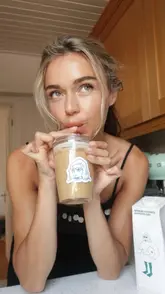 A creator demonstrates how to make a honey vanilla sea salt iced coffee at home using Minor Figures oat milk and a KeepCup.