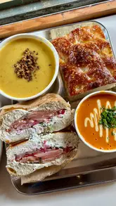 A short, engaging review of Naked Soup in Glasgow, showcasing the cafe's exterior, interior, and a selection of their soups and bagels. The video highlights the quality of the food and the inviting atmosphere, making it a compelling recommendation for a casual lunch spot.