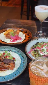 A short, fast-paced montage showcasing a variety of Mexican dishes including tacos, tostadas, and cocktails at a restaurant in Glasgow City Centre.