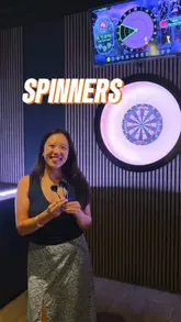A vlog-style video showcasing a visit to Spinners in Reading, highlighting their interactive darts, mini-golf, pizza, and cocktails.