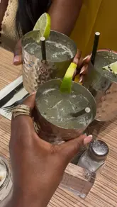 A short video showcasing a bottomless brunch experience at Las Iguanas, featuring various cocktails, main dishes like burritos and curries, and churros, highlighting the student offer and service.