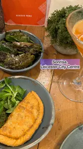 A promotional reel for Sonrisa restaurant, featuring shots of the venue's interior, the bar service, and a selection of dishes including steak and cocktails.