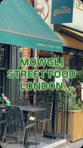 A short, handheld vlog-style reel showcasing a visit to Mowgli Street Food in London, highlighting the vegan menu options including treacle tamarind fries and keema karma.