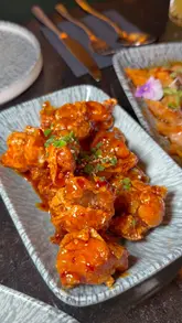 A promotional video for Yibu, a new Asian fusion restaurant in Dublin, showcasing the interior and a variety of dishes including dumplings, popcorn chicken, bao buns, and dessert.