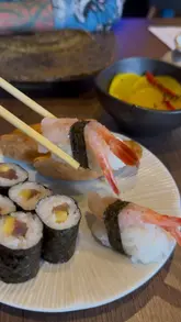 A montage showcasing the 'Sushi Unlocked' all-you-can-eat experience at Ciscoes in Norwich. The video displays the ordering process, the menu, and various sushi and small plates, including sashimi, nigiri, and tempura dishes.