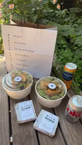 A short, visually clean tour of The Salad Kitchen, highlighting the ordering process, menu options, and the final salad bowl presentation.
