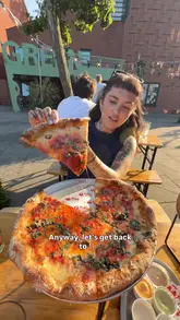 A creator visits The Old Nun's Head in South London to review the pizza from Slice Circle. The video features a tour of the venue, a look at the menu, and a taste test of the Tamil Pie and Cheese Pie, highlighting the quality of the food and the vibe of the pub.