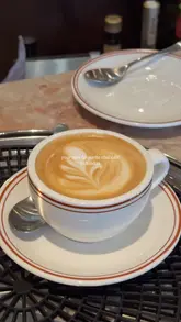 A montage showcasing the interior, coffee, and pastries of Dorothy's, a new cafe located on Savile Row in Mayfair, London.