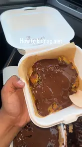 A short, close-up video featuring brownies and cookie dough in takeaway containers being drizzled with chocolate sauce. The video uses a simple text overlay to express desire for the food.
