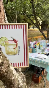 A montage video showcasing an outdoor summer evening event at a vineyard, featuring activities like glass and candle painting, wood-fired flammekueche, and dancing in an orchard.