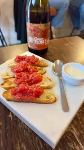 A montage showcasing various Spanish tapas dishes, wine, and the interior atmosphere of Los Hermanos Picaros in South Queensferry.