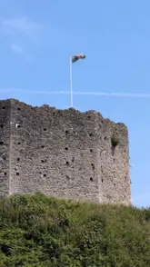 A travel-style montage showcasing various scenes around Cardiff, including landmarks, a bakery, a restaurant, and outdoor areas.
