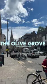 A personal review of The Olive Grove in Cambridge, featuring a visit to the restaurant, a look at the menu, and a taste test of dishes including calamari, chicken thighs, and a pita wrap. The creator highlights the home-cooked vibe and the quality of the food.