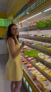 A creator visits Mr Wang Hot Pot in Oxford, demonstrating the DIY selection process where customers pick their own ingredients from a fridge, have them weighed, and then served as a hot pot. The video highlights the variety of vegan options available and the comfort of the air-conditioned venue.