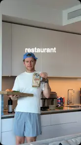 A creator recreates a plant-based burger slider from a Holland & Barrett pop-up called 'The Wellness Tap' in a home cooking tutorial.