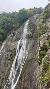 A travel vlog guide to the Aber Falls walk in North Wales, detailing the path, parking, and experience.