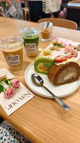 A short, aesthetic reel documenting a pop-up collaboration between 'See You At Jens' and 'Okaeri'. The video features close-ups of specialty cake rolls, matcha drinks, the queue outside the venue, and the overall atmosphere of the event.