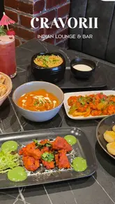A promotional video for Cravorii restaurant in Bury, showcasing the interior decor, menu items, and cocktails.