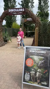 A family-friendly promotional video for the 'Dinosaurs in the Hidden Garden' event at Bents Garden Centre, featuring animatronic dinosaurs, a trail map, and an excavation zone for children.