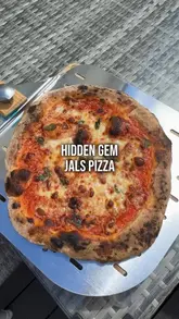 The video features a quick, engaging demonstration of preparing and cooking vacuum-packed pizzas from Jal's Pizza. It highlights the convenience and quality of the product, showing the pizzas being cooked in a portable oven and then sliced for serving.