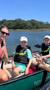 A family-oriented vlog showcasing a canoeing trip on the Beaulieu River with New Forest Activities. The video follows the family from getting kitted out with life jackets to paddling on the water and swimming, highlighting the guided nature of the experience and the scenic river setting.