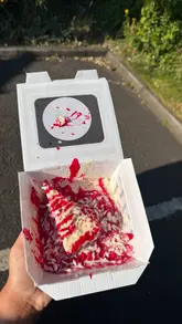 A group of friends visits a drive-thru dessert venue in Glasgow, showcasing the exterior, a punch-bag game, and a variety of indulgent desserts including milkshakes, a munchie box, cheesecake, and a croissant.
