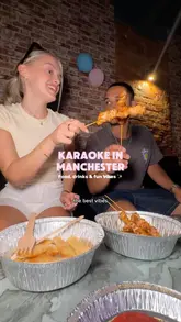 A couple visits a karaoke venue in Manchester, showcasing the private booth, the digital ordering system for food and drinks, and the various entertainment options available, including singing, darts, and dice games.