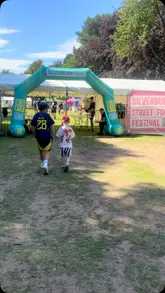 A montage video showcasing the Silverburn Street Food Festival, featuring various food stalls, live music, and children's entertainment like bouncy castles and face painting.