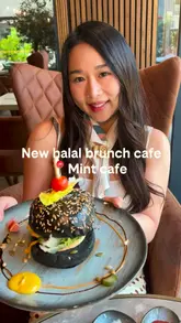 A review of Mint Cafe, showcasing their halal brunch menu including a charcoal beef burger, steak sandwich, and pancakes, alongside the cafe's aesthetic interior.