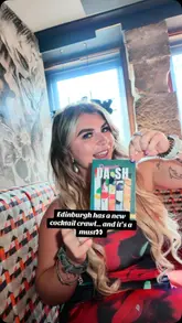 A couple documents their experience participating in the 'Daiquiri Dash' cocktail crawl across five different bars in Edinburgh. They visit Cold Town House, Copper Blossom, Element, Boozy Cow, and The Basement, showcasing the unique cocktails at each location and sharing their personal favorites.