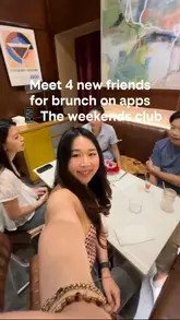 A vlog-style video documenting a brunch meetup at Soho Social, where the creator meets three strangers to socialize. The video features shots of the venue interior, the food ordered, and the group interacting, highlighting the social aspect of the experience.