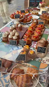 A short, montage-style video showcasing Ems & Co. pastry shop in Crieff, featuring exterior shots, the window display, the interior menu, and close-ups of various pastries.