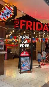A family-focused promotional video for TGI Fridays highlighting their 'Kids Eat Free' offer. The video features a montage of the family arriving, ordering, and enjoying various meals, including pasta, chicken tenders, and desserts, while emphasizing the ease of using the rewards app.