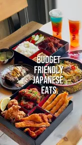 A visually-driven reel showcasing a variety of Japanese dishes including a bento box, yaki udon, and a brownie at Yaki Ya! in London, set to music with text overlays.