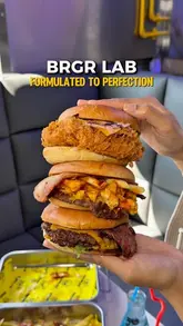 A promotional video for BRGR Lab featuring a variety of their menu items including smash burgers, loaded fries, buttermilk tenders, and mocktails. The video uses quick cuts and handheld shots to highlight the food and the venue's casual atmosphere.