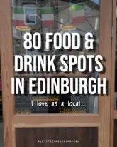 A cover image for a listicle video featuring 80 food and drink recommendations in Edinburgh. The image uses a blurred background of a shop front with clear text overlay to communicate the video's topic.