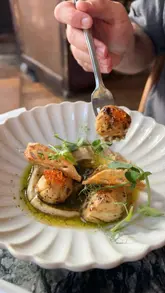 A short, visually appealing montage showcasing various seafood and meat dishes at The Wet Fish Cafe in West Hampstead. The video features close-up shots of scallops, mussels, seafood pasta, steak, and a cocktail, highlighting the freshness and presentation of the food.