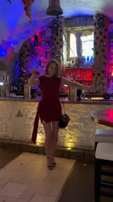 A group of friends celebrates a 40th birthday at a Greek restaurant, showcasing the venue's atmosphere, meze-style food, cocktails, and the traditional plate-smashing experience.